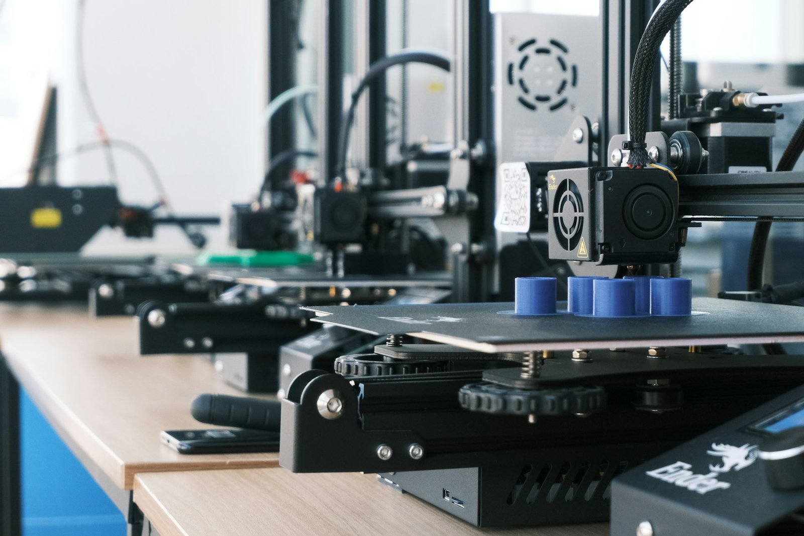 Desktop 3D printers producing plastic demonstration parts