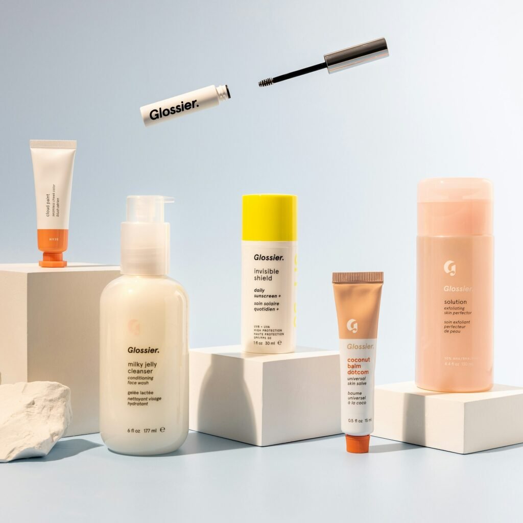 Skincare bottles displayed on white pedestals