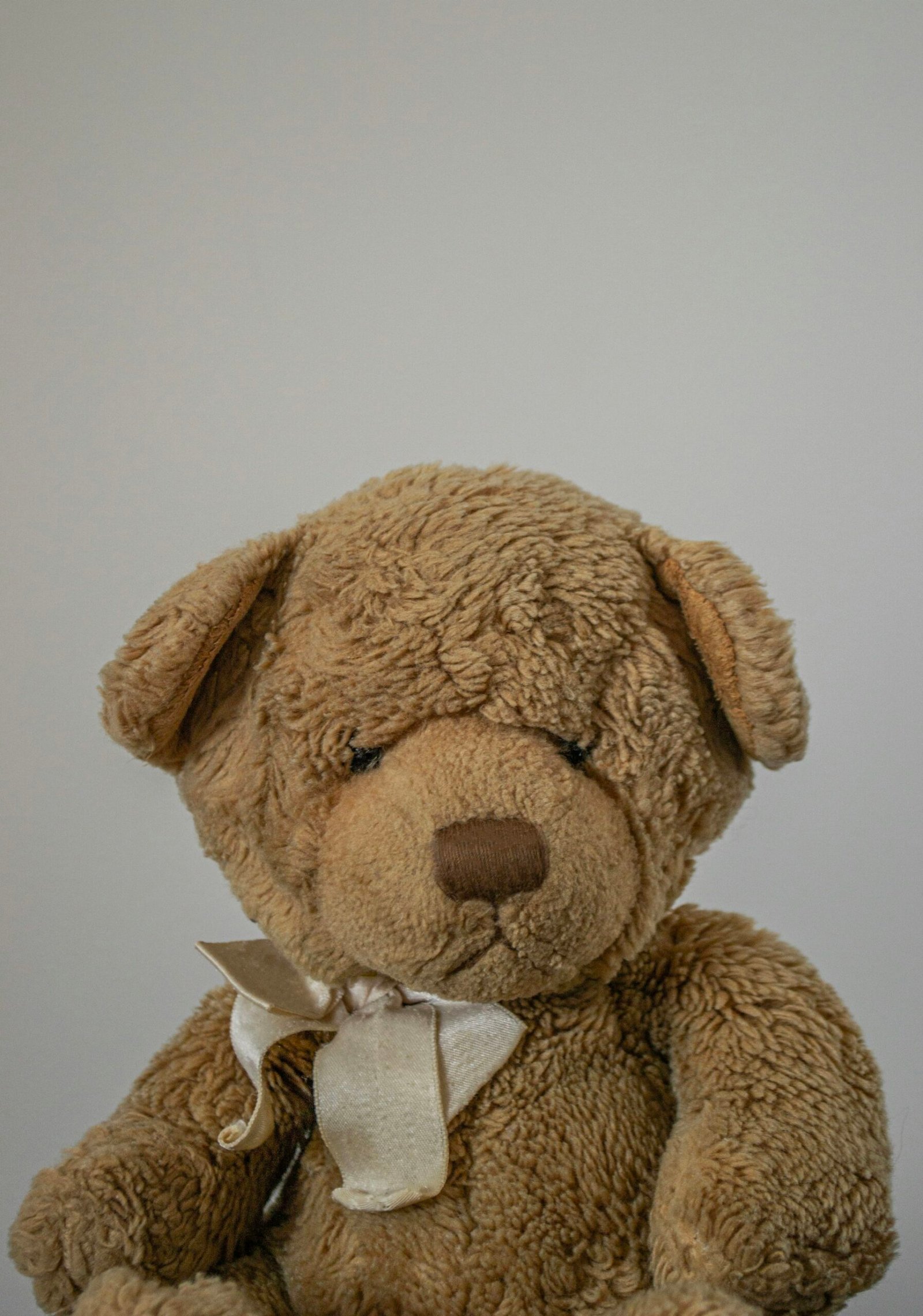 Small teddy bear sitting on a table