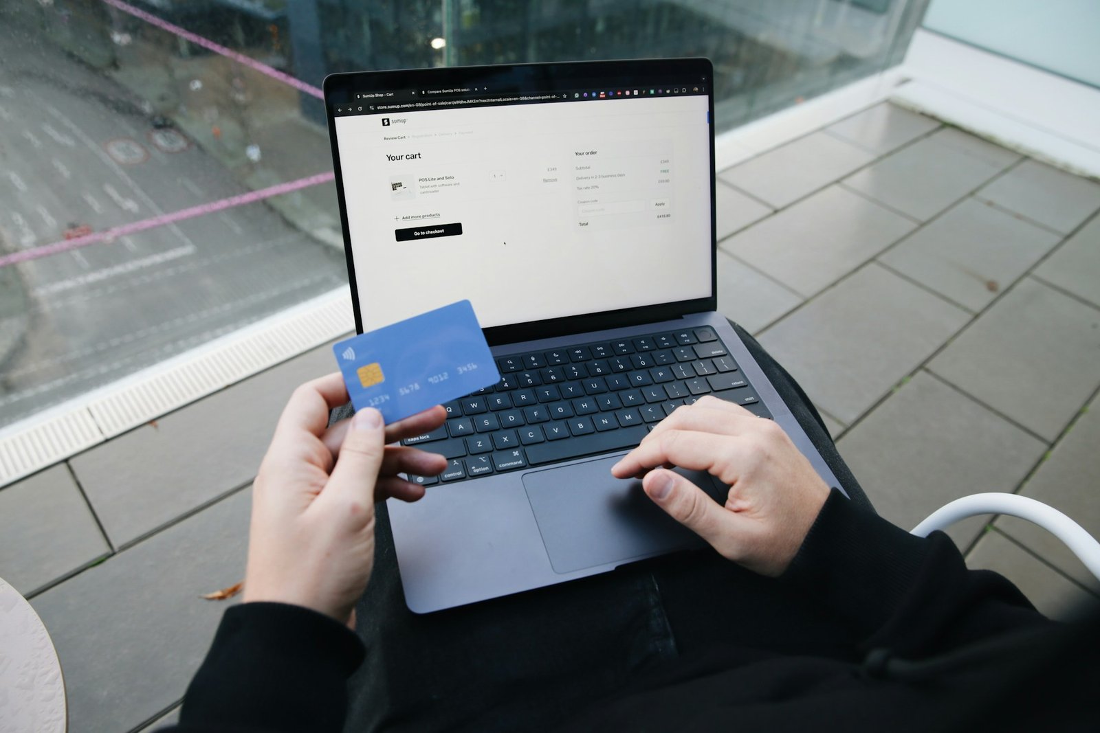 Shopper reviewing online checkout details before using a coupon